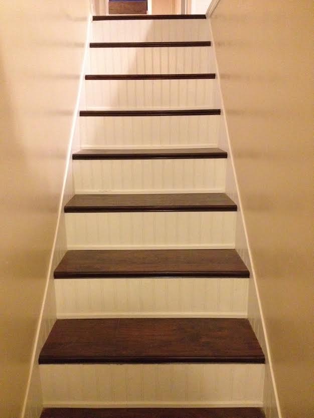 a staircase with white walls